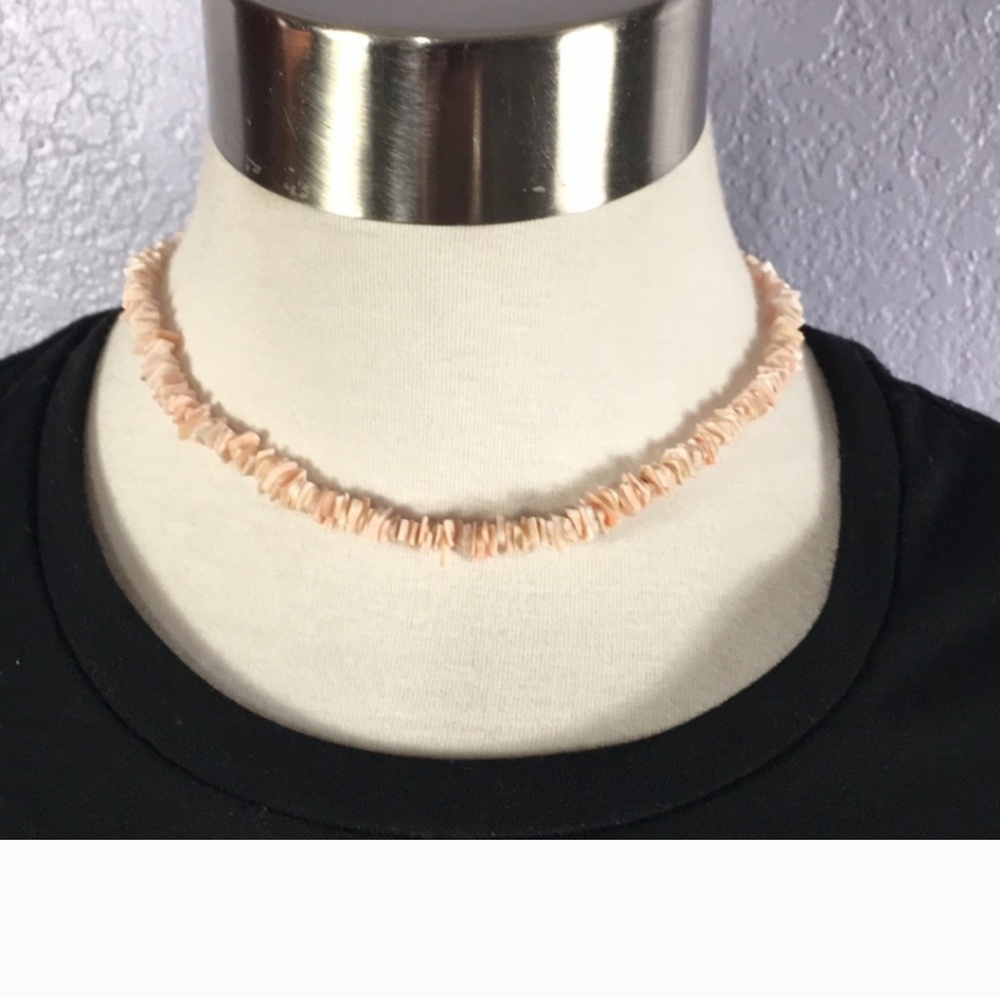 Vintage coral colored puka shell necklace